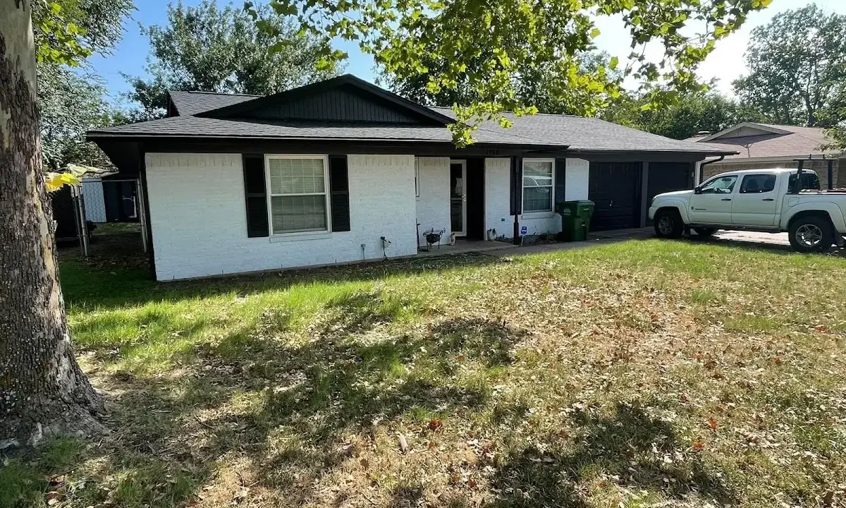 Professional roofing crew working on a residential roof in Waynesville